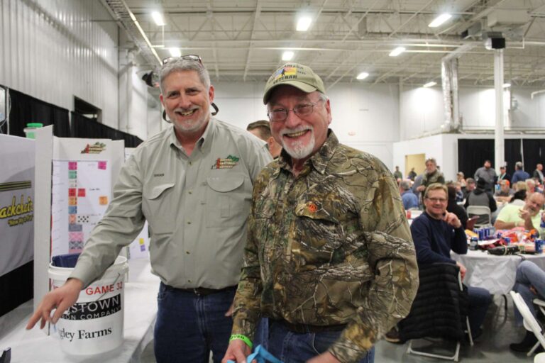 two men in smiling at camera